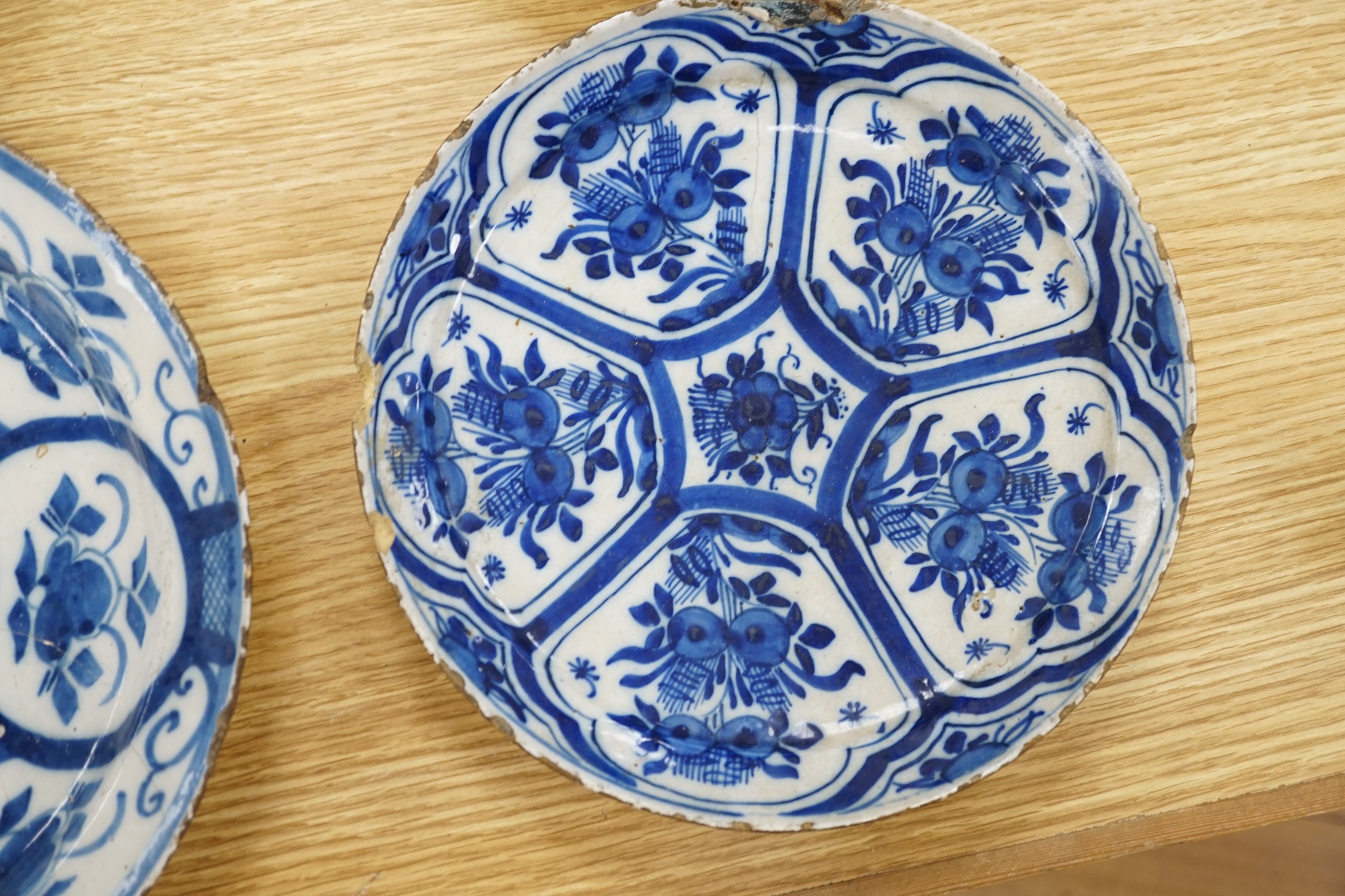 Four various continental delftware dishes, 18th and 19th century, largest 31cm diameter. Condition - various cracks and chipping to edges